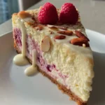 Cardamom Infused Raspberry Swirl Cheesecake With White Chocolate Glaze 1767809866.860018