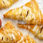 Golden Peach Puff Pastry Turnovers 4 Golden Peach Puff Pastry Turnovers